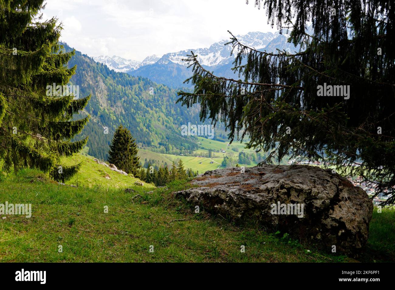 alpine view from a hiking trail in the scenic sun-drenched Bavarian Alps against the clear blue sky on a beautiful spring day in Oberjoch in Bavaria ( Stock Photo