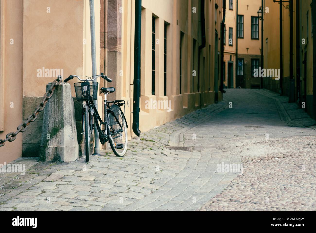 Vintage bike in old cobbled street of old town, Swedish: Gamla Stan, in Stockholm, Sweden Stock Photo