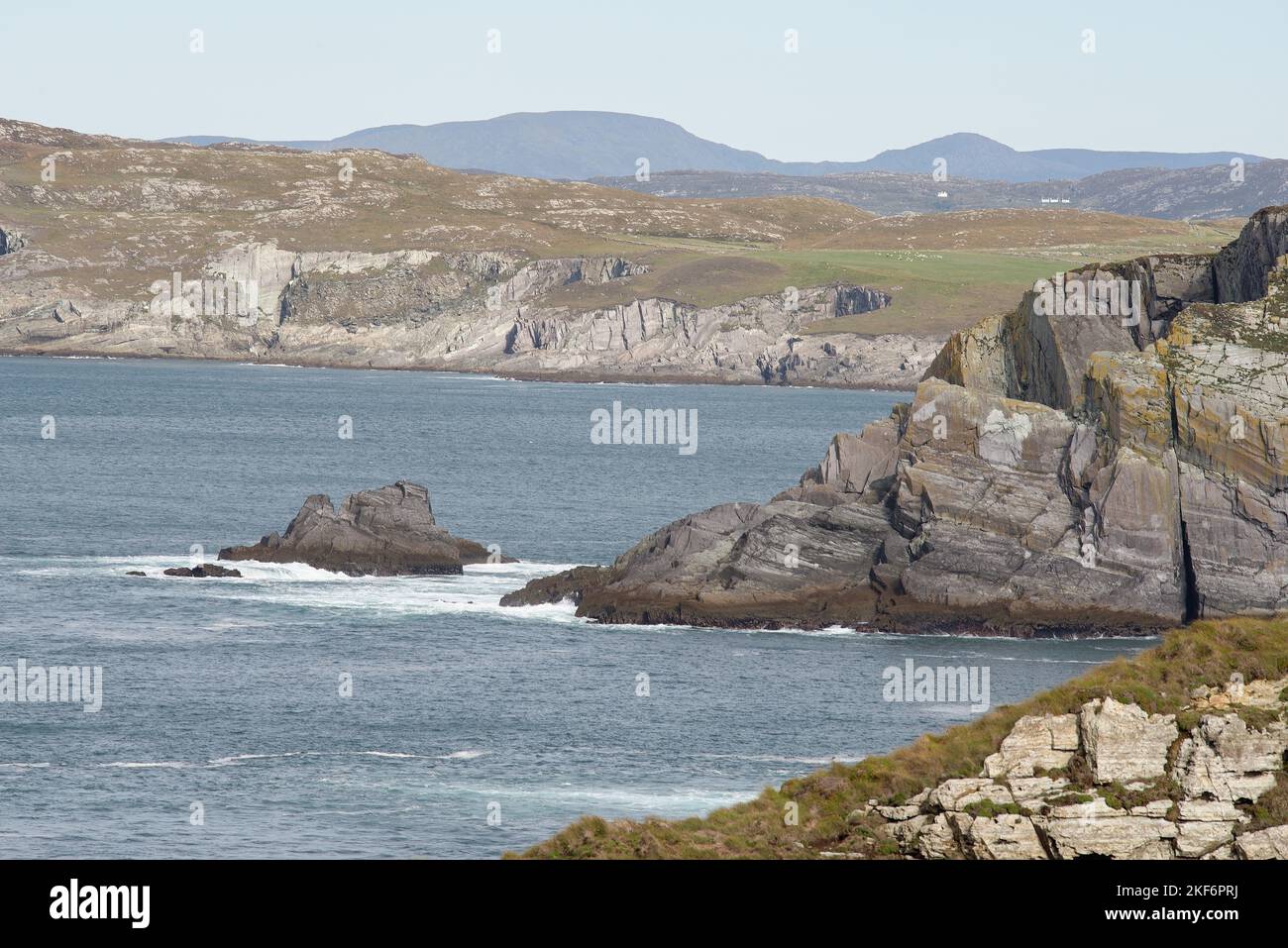 Atlantic coast of Southern Ireland. County Cork coastline. Sea and rural green countryside. Stock Photo