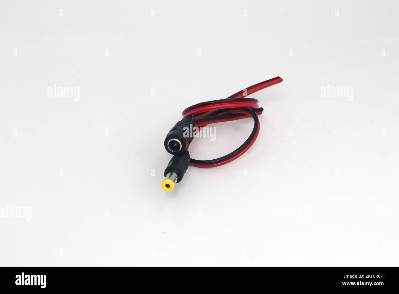 DC 12V male and female connector cables on a white background. Electronic parts used by hobbyists as connectors used to connect the power supply. Stock Photo
