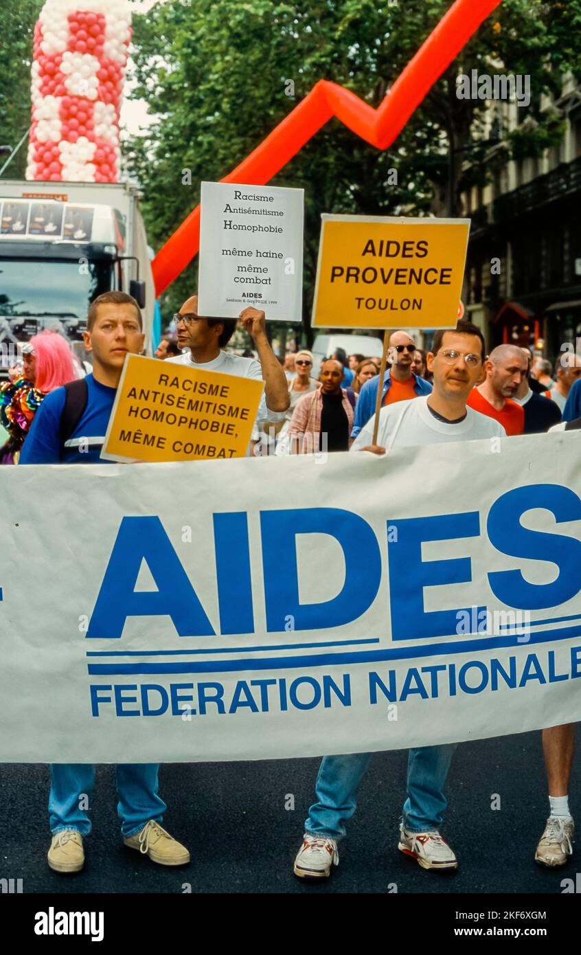 Paris, France, Crowd , AIDES NGO, Aids Activists Protesting  with Signs at Gay Pride, LGBTQI+, Bruno, aids 1990s, logo archives, Awareness and Prevention program Stock Photo