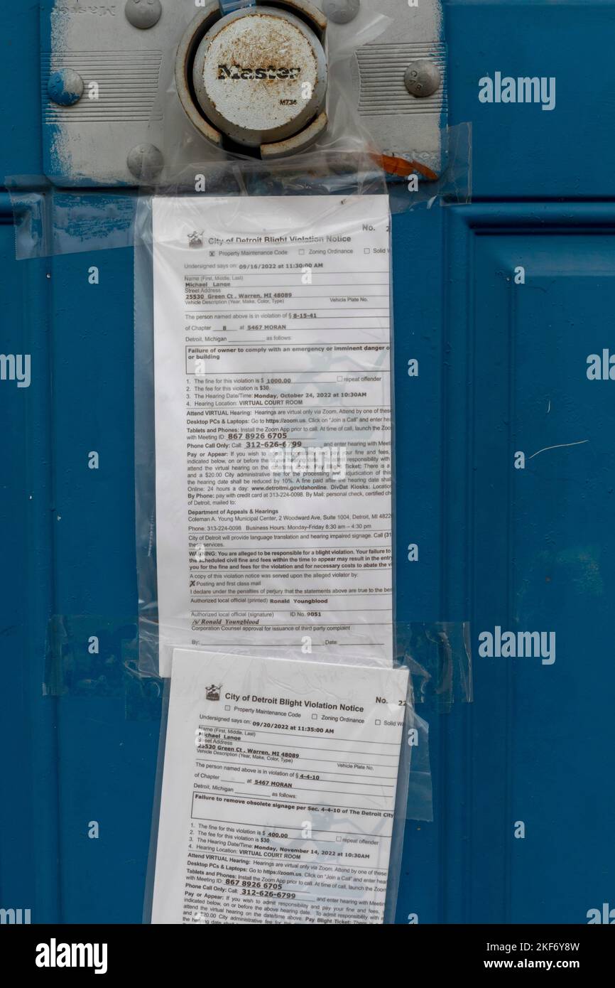Detroit, Michigan - Blight violation notices taped to the door of a vacant commercial building on Detroit's near east side. Stock Photo