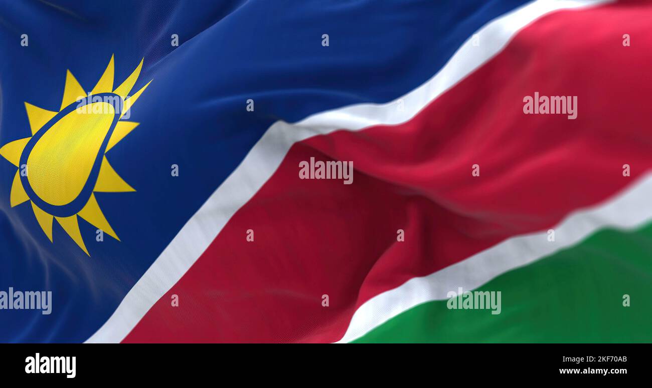 Close-up view of the Namibia national flag waving. Republic of Namibia is a country in Southern Africa. Fabric textured background. Selective focus. 3 Stock Photo