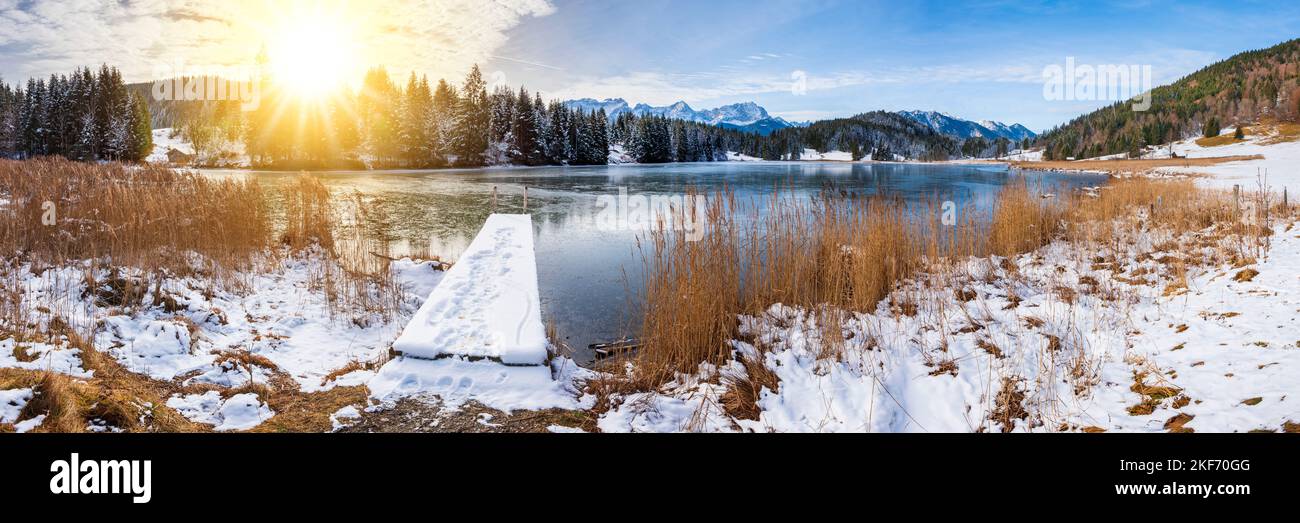 panoramic landscape with mountain range and lake at winter Stock Photo