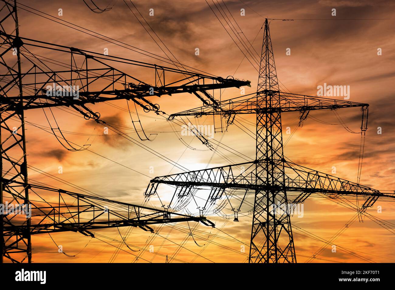 pylons and high voltage cable for electricity and energy Stock Photo
