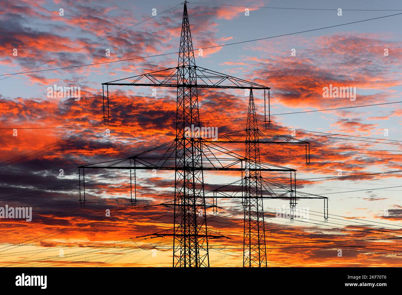 pylons and high voltage cable for electricity and energy Stock Photo