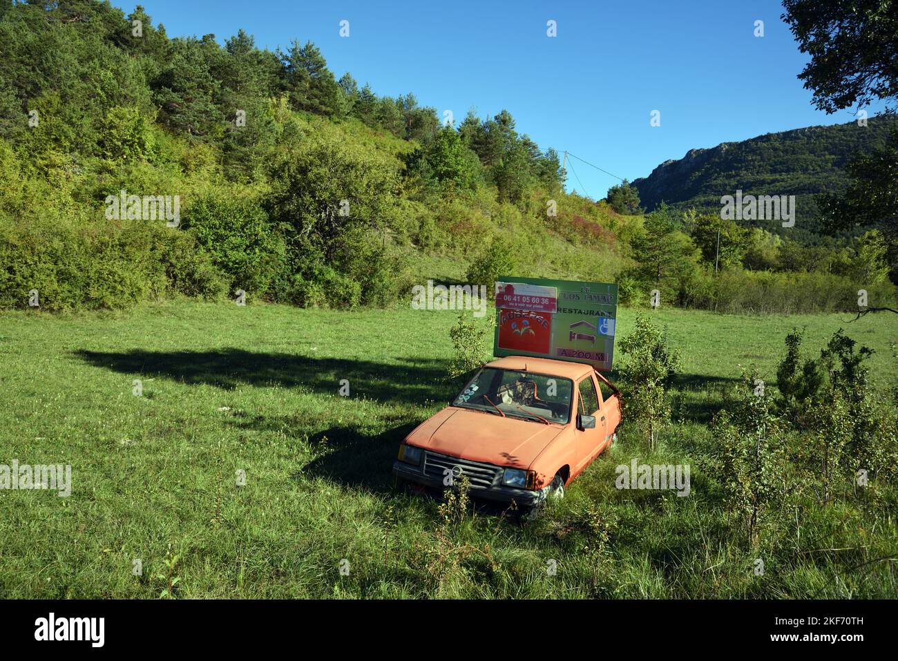 Old Opel Used as Roadside Advertising Car for Hotel and Restaurant on the Route Napoleon near Senez Alpes-de-Haute-Provence Provence France Stock Photo