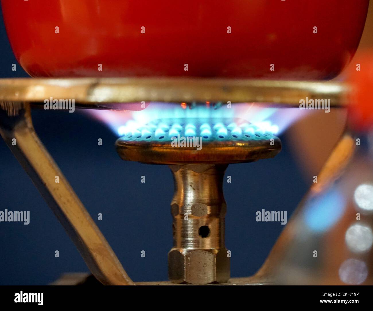 Turkish coffee pot and coffee boiling on gas stove, strong drink.close