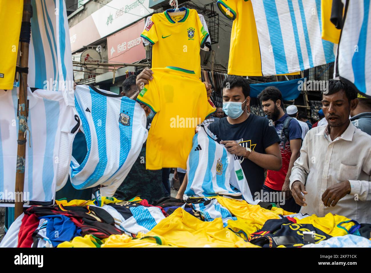 Dhaka, Bangladesh. 16th Nov, 2022. Bangladeshi vendors sell Brazil and Argentina jersey ahead of