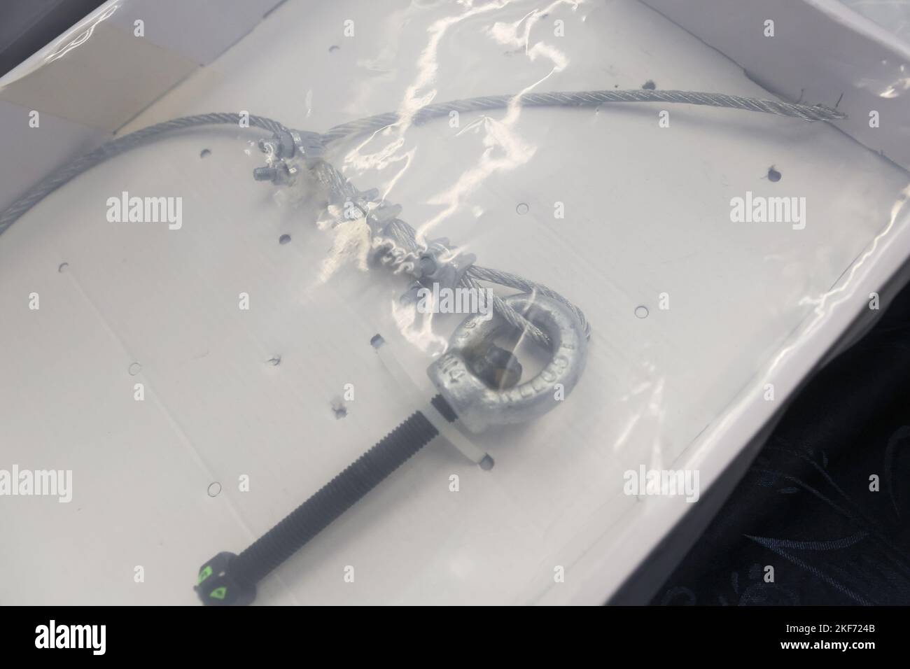 A piece of broken cable is displayed during a press