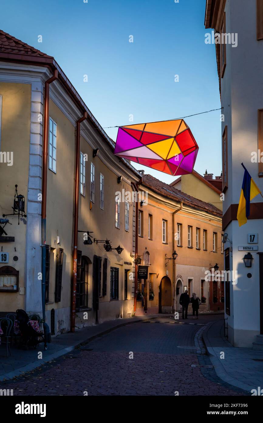 Vilnius, Lithuania - September 26, 2022: A historical street, which was a part of Jewish ghetto in World War II. A colorful decorative polyhedron lantern. Stock Photo
