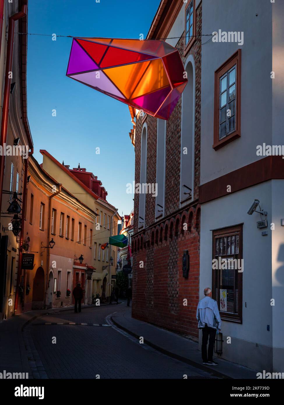 Vilnius, Lithuania - September 26, 2022: A historical street, which was a part of Jewish ghetto in World War II. A colorful decorative polyhedron lantern. Stock Photo