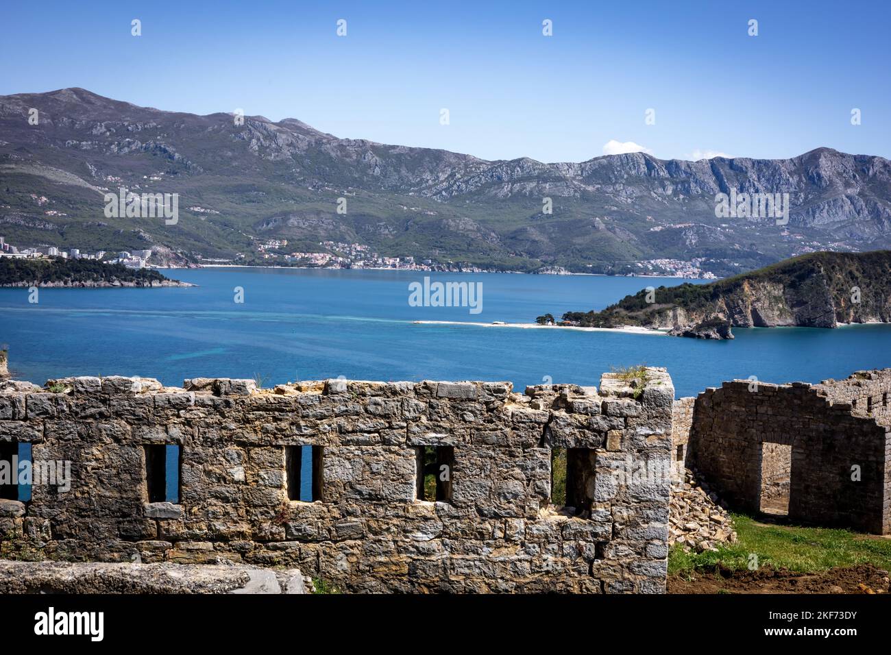 Budva, Montenegro - April 28, 2022:  A view to Sveti Nikola (Hawaii) Island on Adriatic sea from the walls of medieval citadel in Budva, Montenegro. Stock Photo