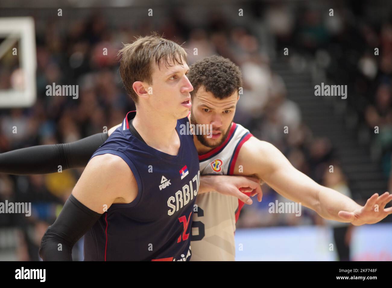 Newcastle upon Tyne, England, 11 November 2022. Aleksa Radanov of Serbia and Luke Nelson playing for Great Britain in the FIBA Basketball World Cup 2023 Qualifiers at the Vertu Motors Arena. Credit: Colin Edwards Stock Photo