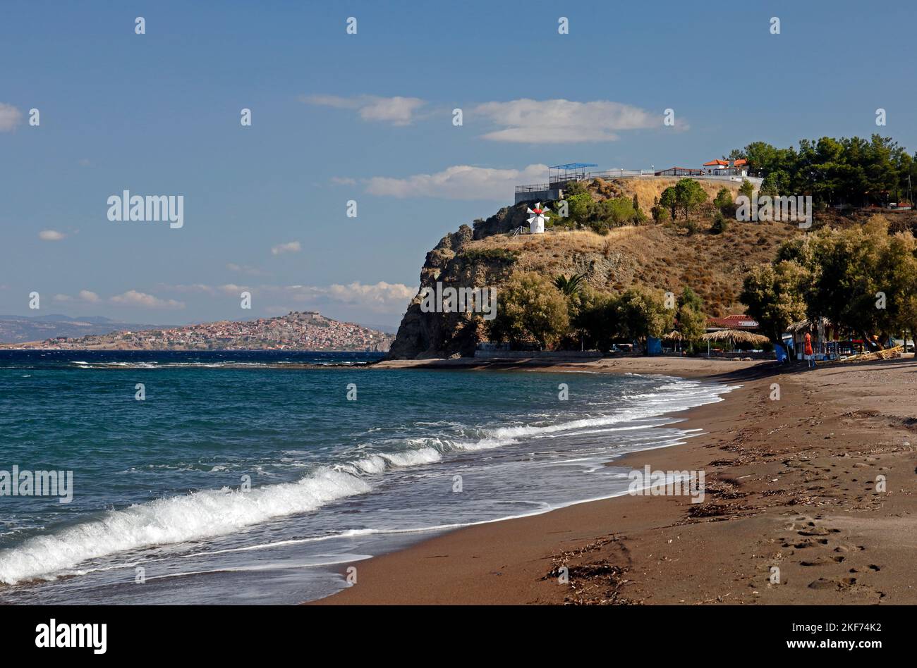 Anaxos beach with pretty windmill on a headland.. October 2022. Autumn. Stock Photo