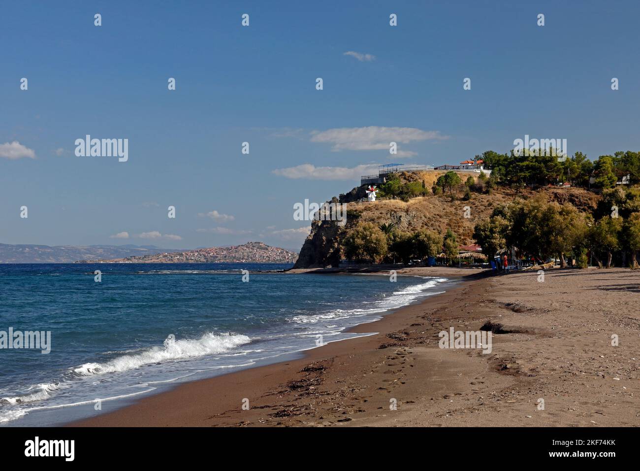 Anaxos beach with pretty windmill on a headland.. October 2022. Autumn. Stock Photo