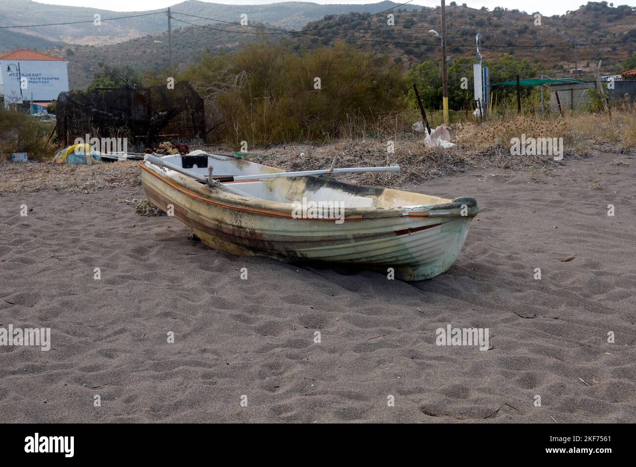 Anaxos beach, old rowing boat pulled up onto the sand.  Lesbos, Greece. October 2022. Autumn. Stock Photo