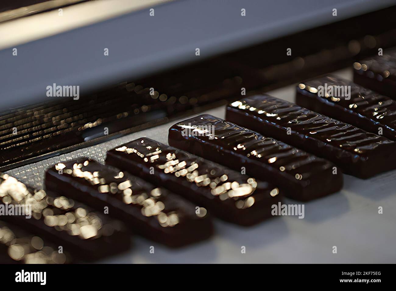 Close up of chocolate conveyor belt on the factory. Chocolate ...
