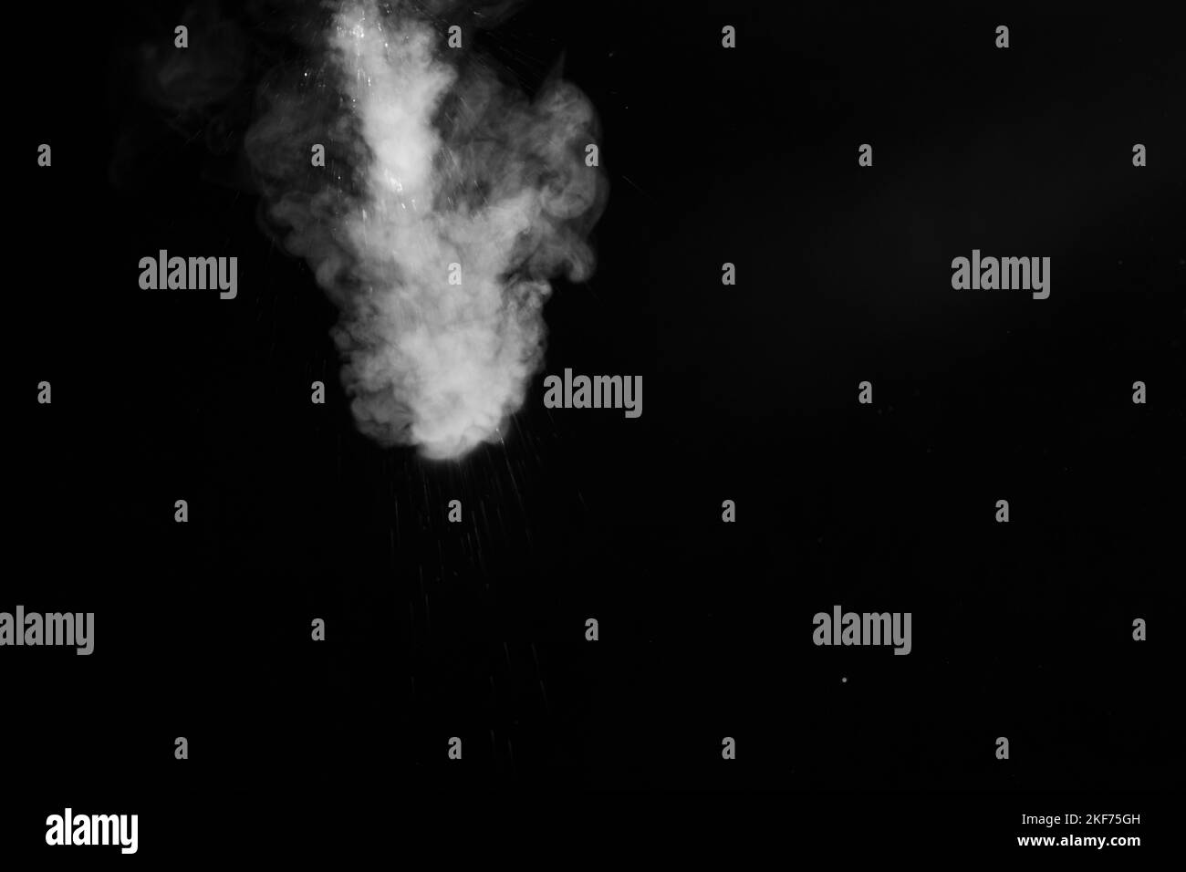 the movement of hot steam with water droplets is isolated on a black background to overlay your photos. Steam background, abstract smoke on a black ba Stock Photo