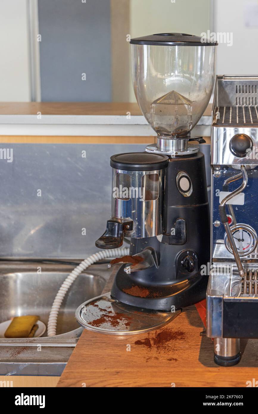 Professional Espresso Coffee Burr Grinder Machine in Cafe Stock Photo