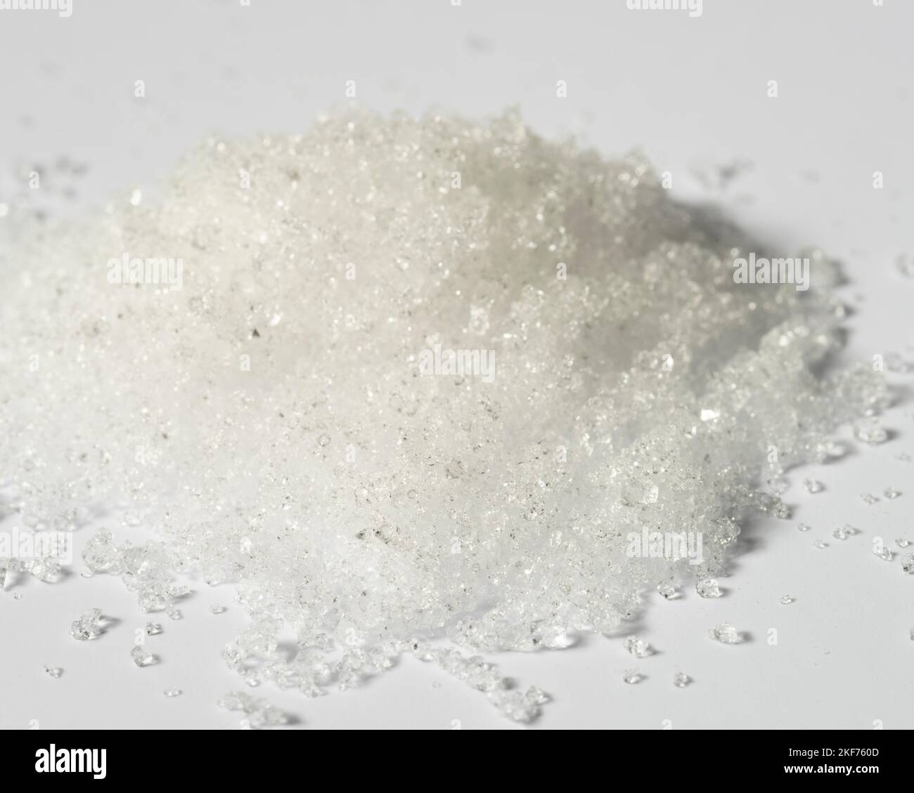 Alum powder, potassium aluminum sulfate powder on white background