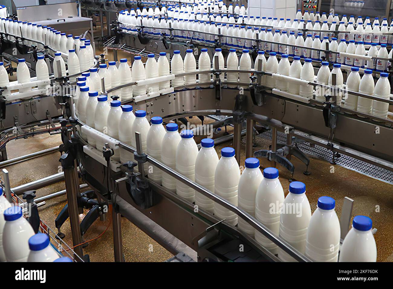 Dairy factory. Milk line production Stock Photo - Alamy