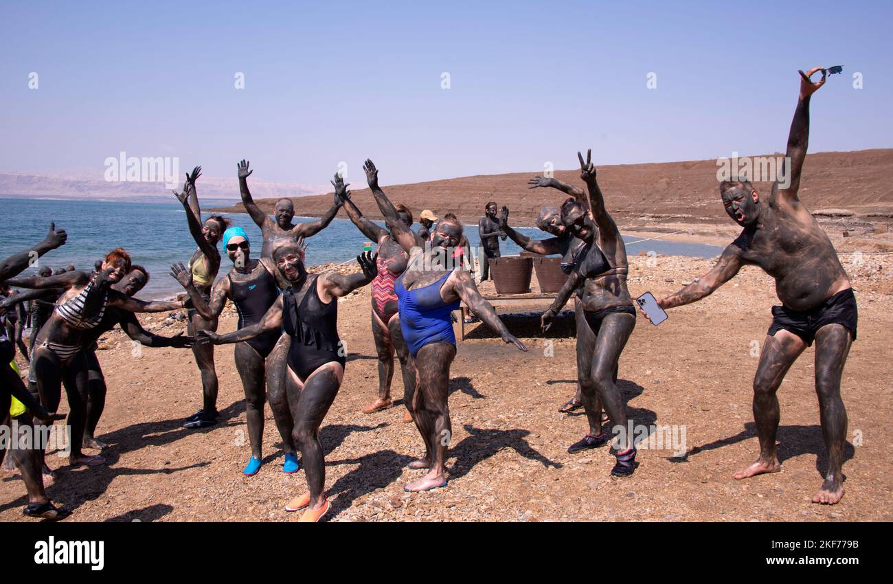Group of people covered in mud Dead Sea Jordan Stock Photo Alamy