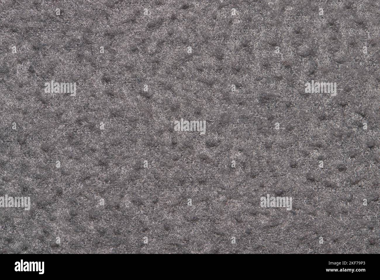 Color swatch sample, solid gray clothing material item. Background textile section with copy space. Stock Photo