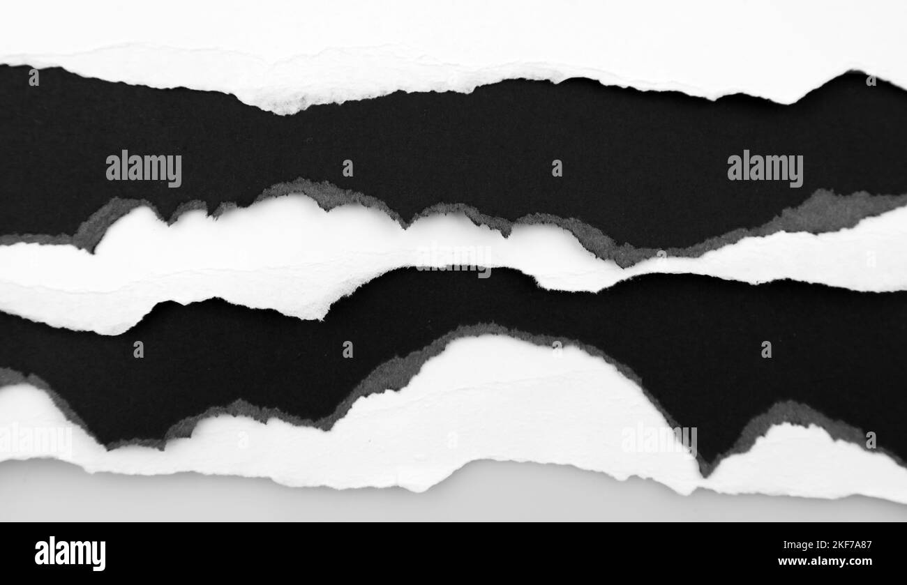 Ripped black and white paper edges background Stock Photo