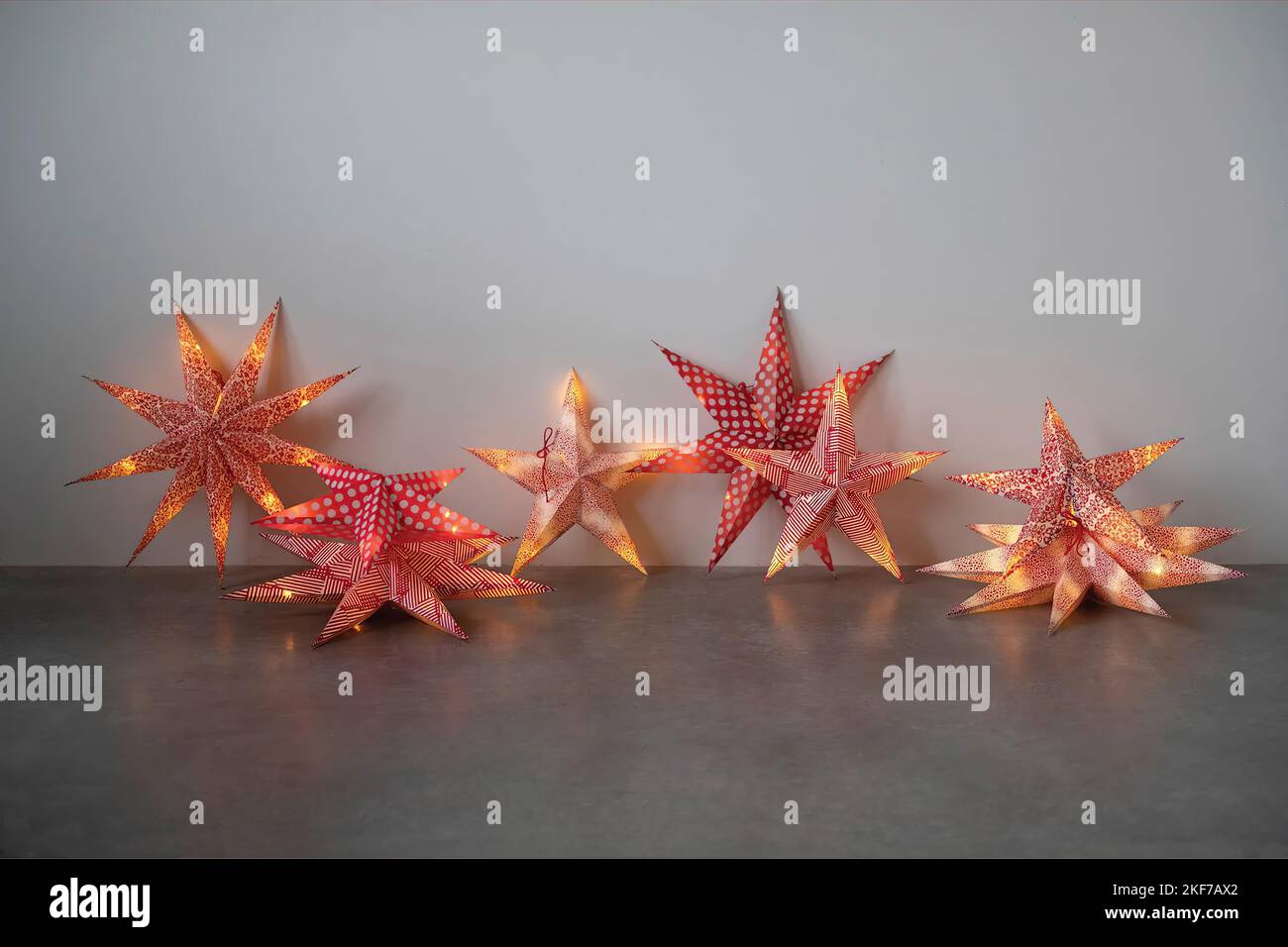 Christmas stars with ligths on grey background Stock Photo Alamy