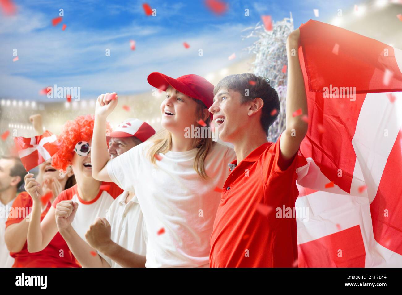 Denmark football supporter on stadium. Danish fans on soccer pitch