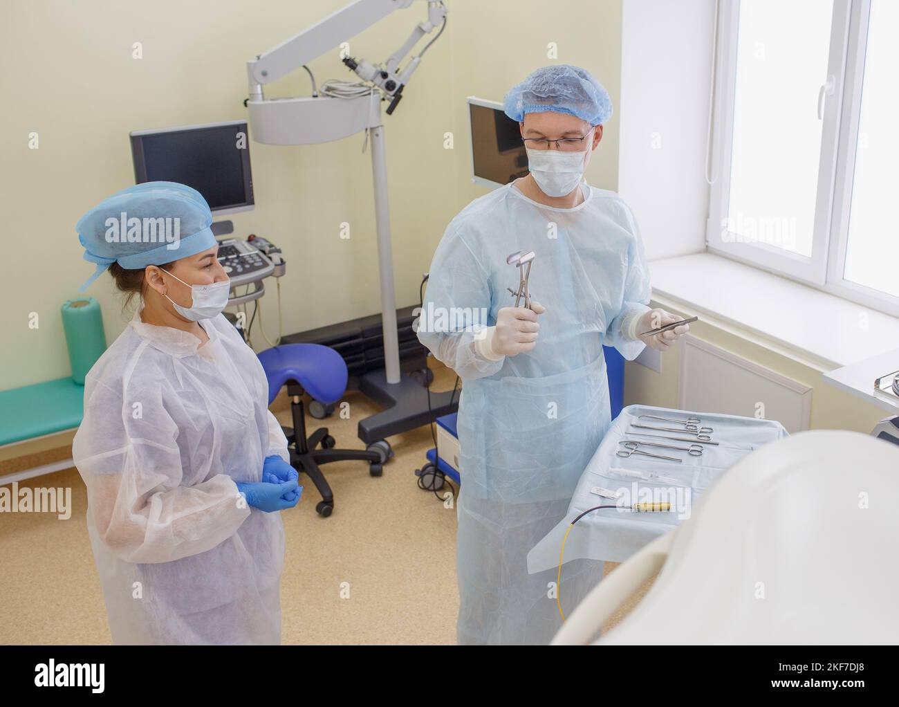 a proctologist prepares expansion instruments for surgery in the proctological operating room. Stock Photo