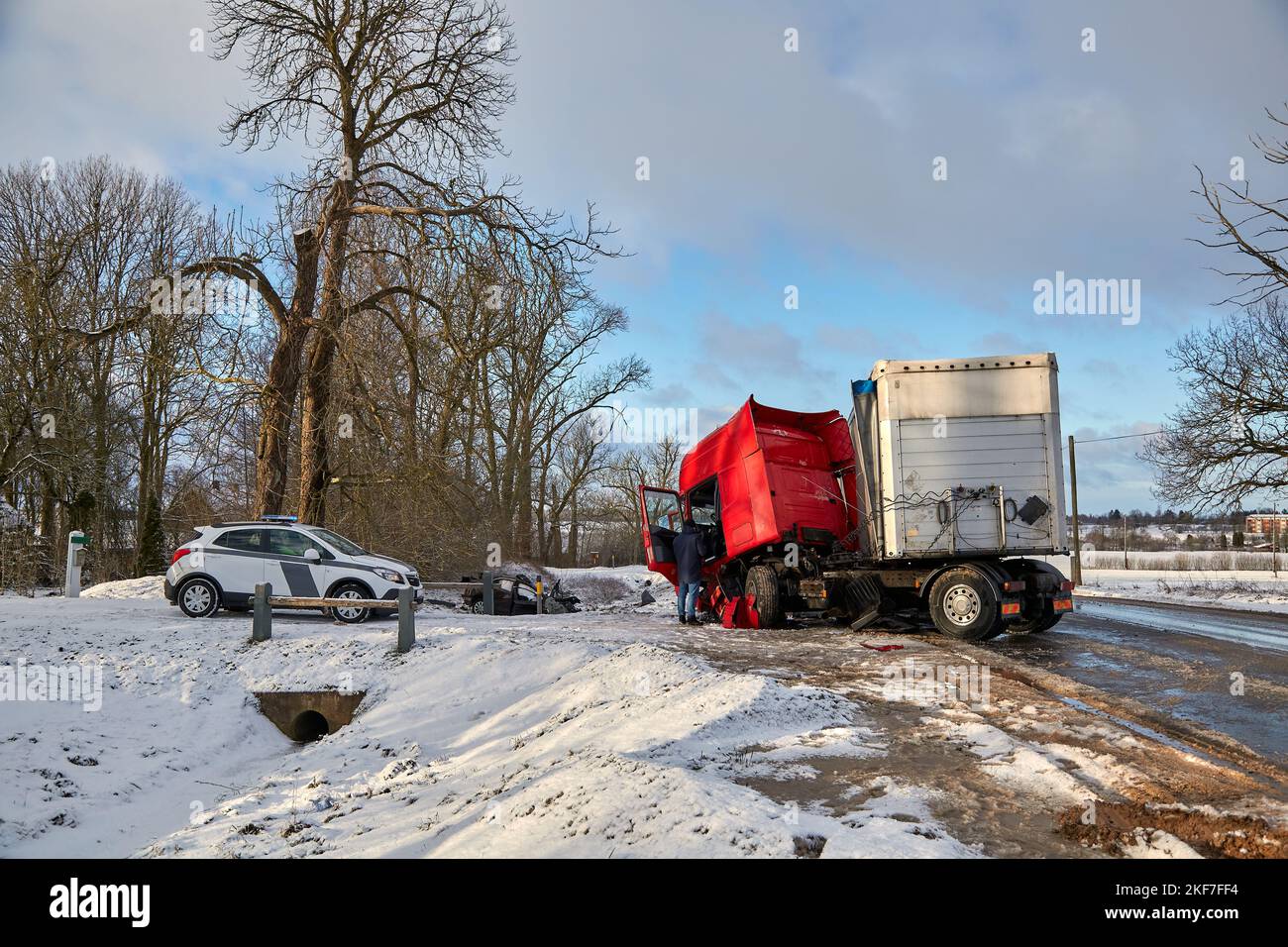 January 6, 2021, Eleja, Latvia: car after accident on a road because of collision with a truck, transportation background Stock Photo