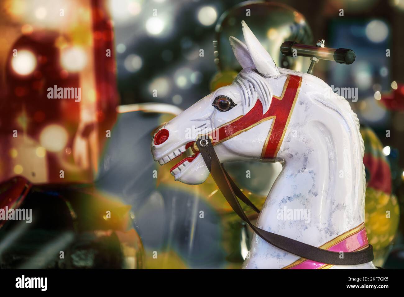 Horse head from a children carousel at a winter fair, copy space, selected focus Stock Photo