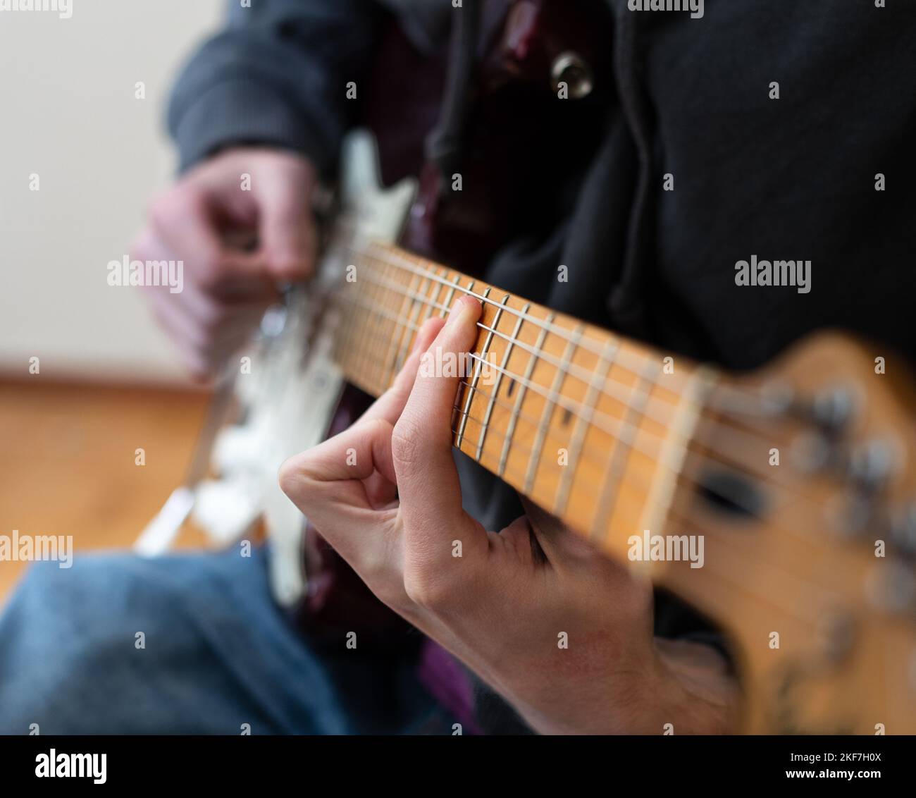 Male person playing an electric guitar Stock Photo Alamy