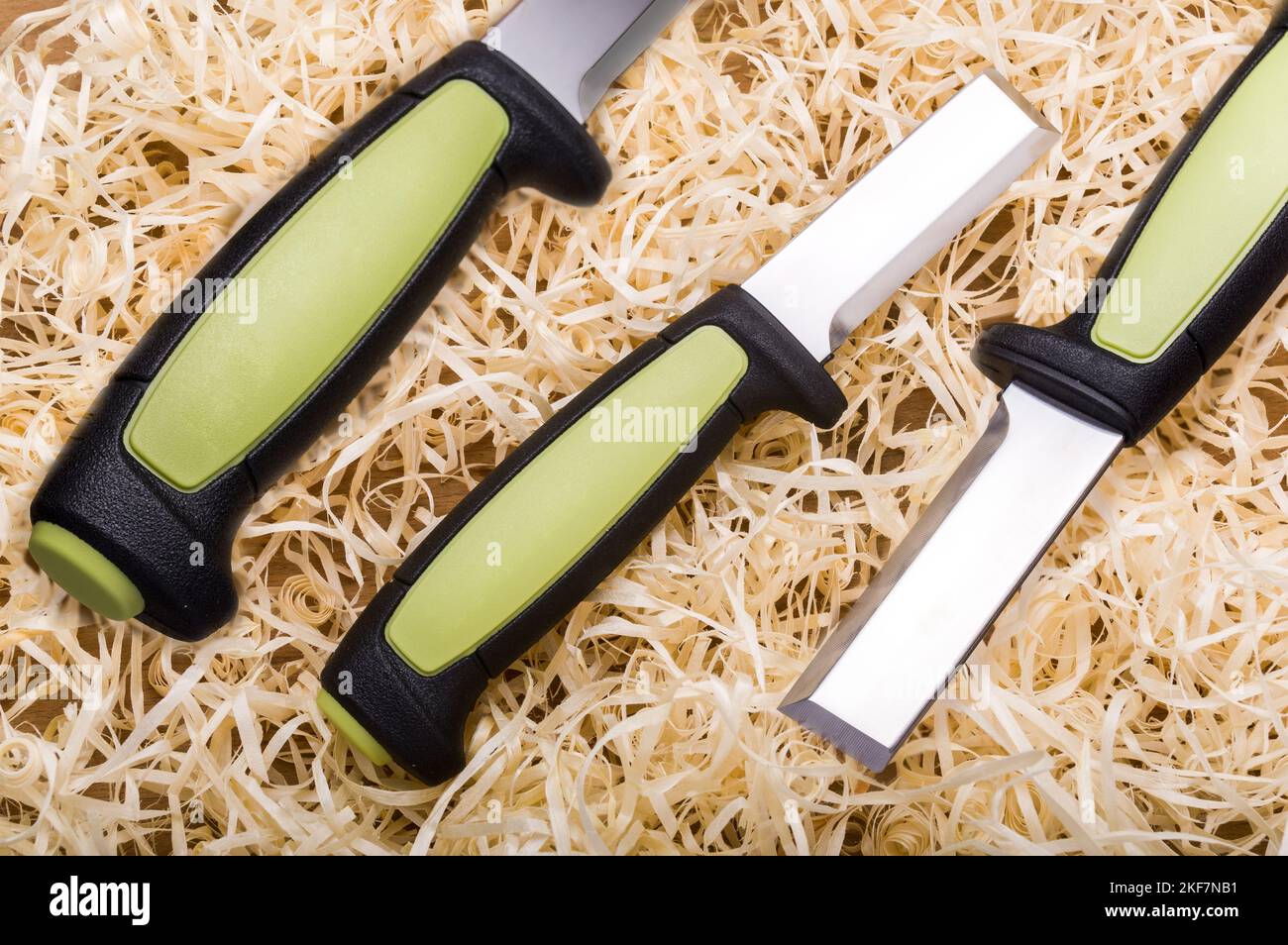 Woodworking tool. Carpentry tool. Sharp chisel and wood shavings. Wood