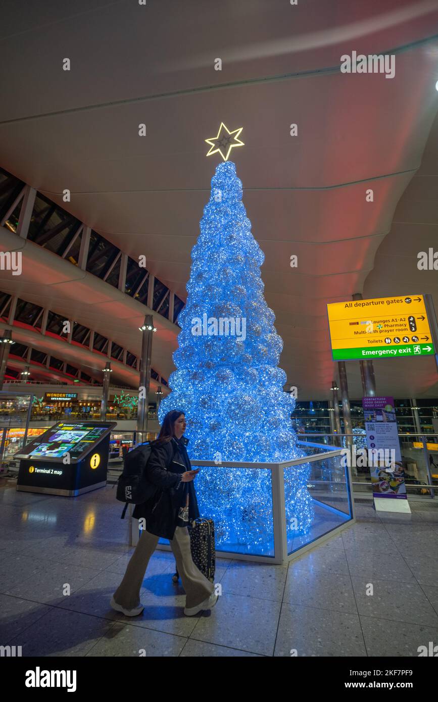 London UK. 16 November 2022. An illuminated christmas tree at a quiet Heathrow terminal 2