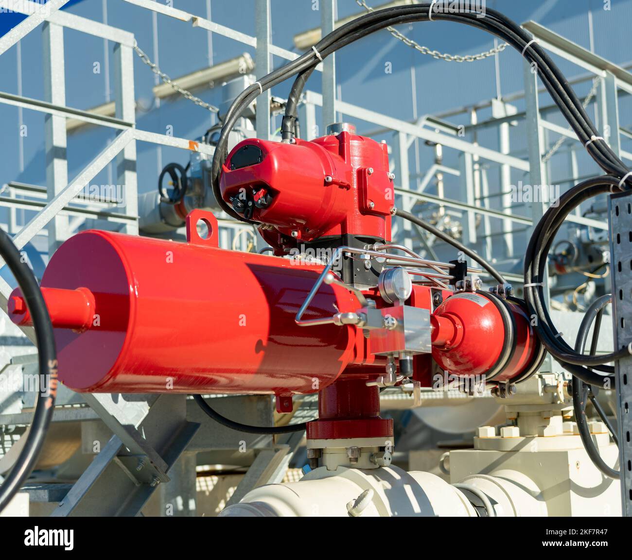 Emergency valve on gas equipment with a red actuator Stock Photo Alamy
