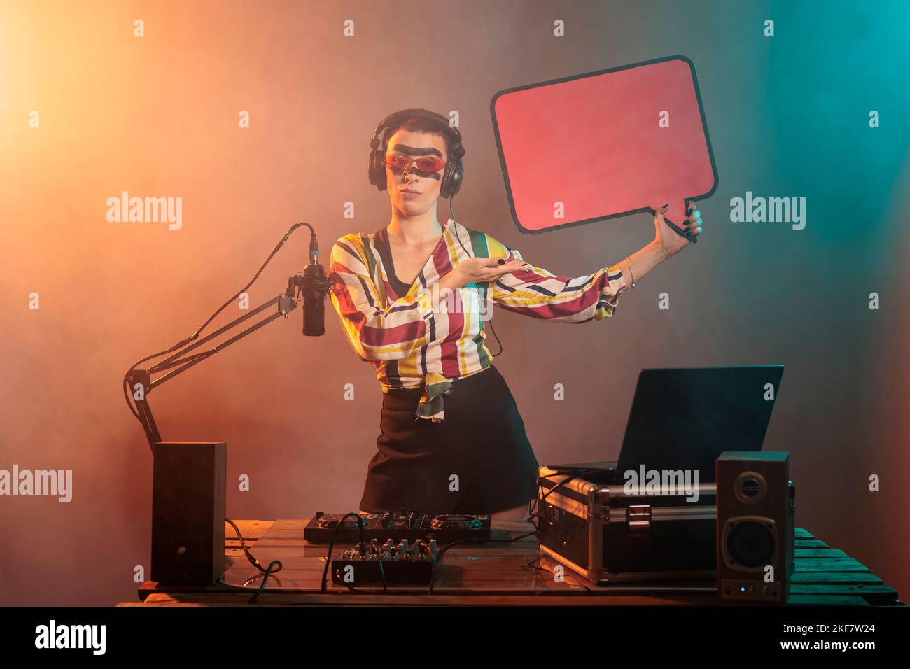 Disc jockey advertising carton speech bubble in studio, showing