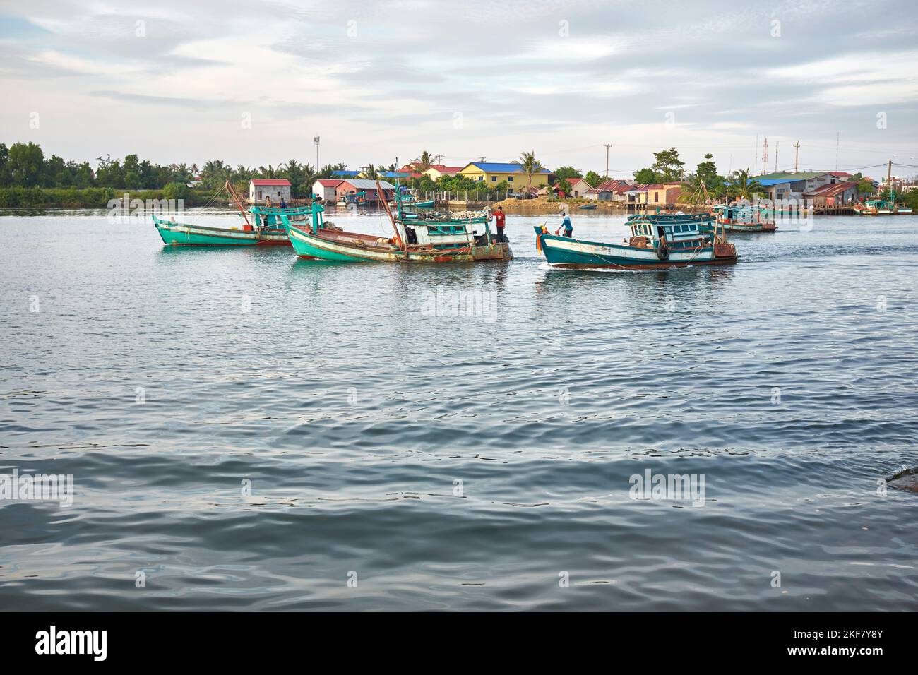 Fishing Boats on the river in  Kampot Cambodia Stock Photo