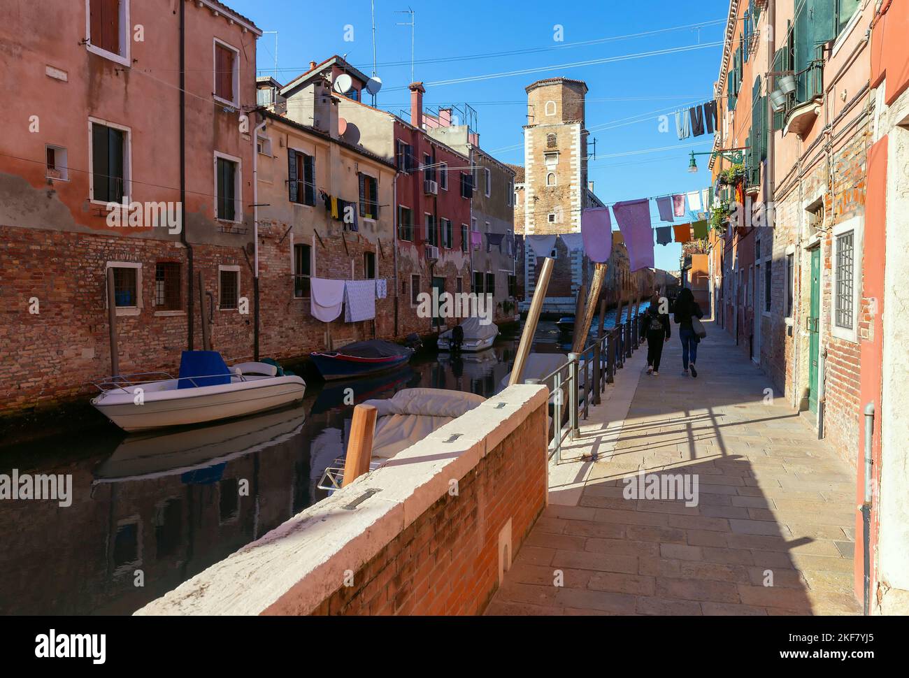 Traditional old colorful houses along the canal on a sunny day. Venice ...