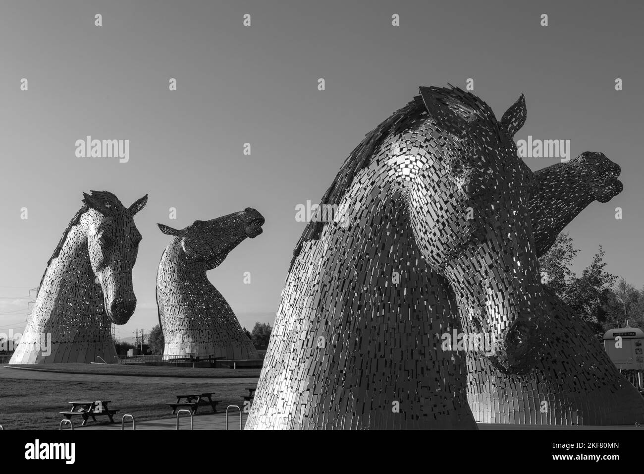 A grayscale of the sculpture of The Kelpies horses under the clear sky, Scotland Stock Photo