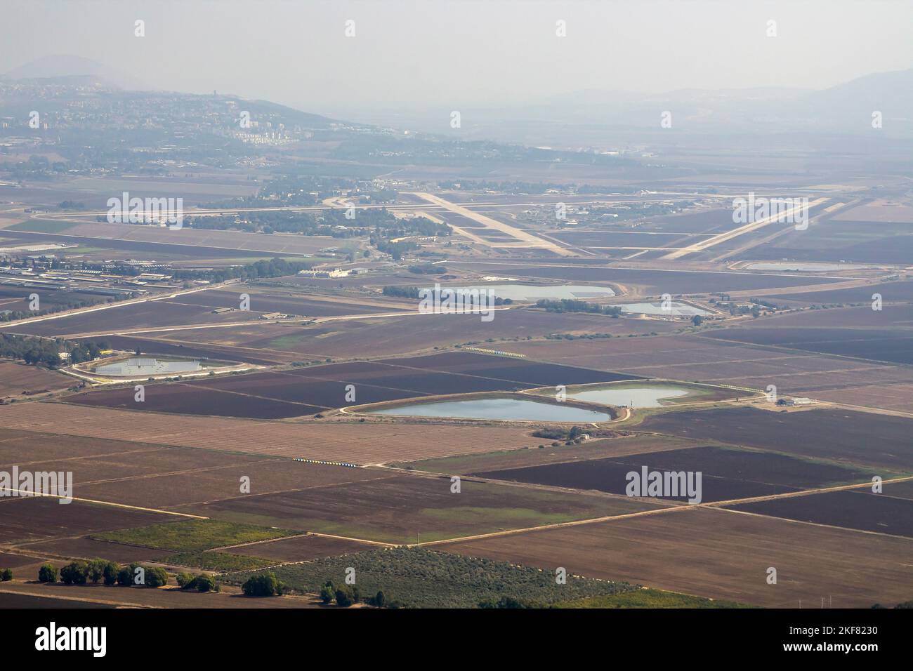 A view of an Israeli Airbase through the haze from Mount Carmel. This region of Megiddo is the so called crossroads of the world joining east to West Stock Photo