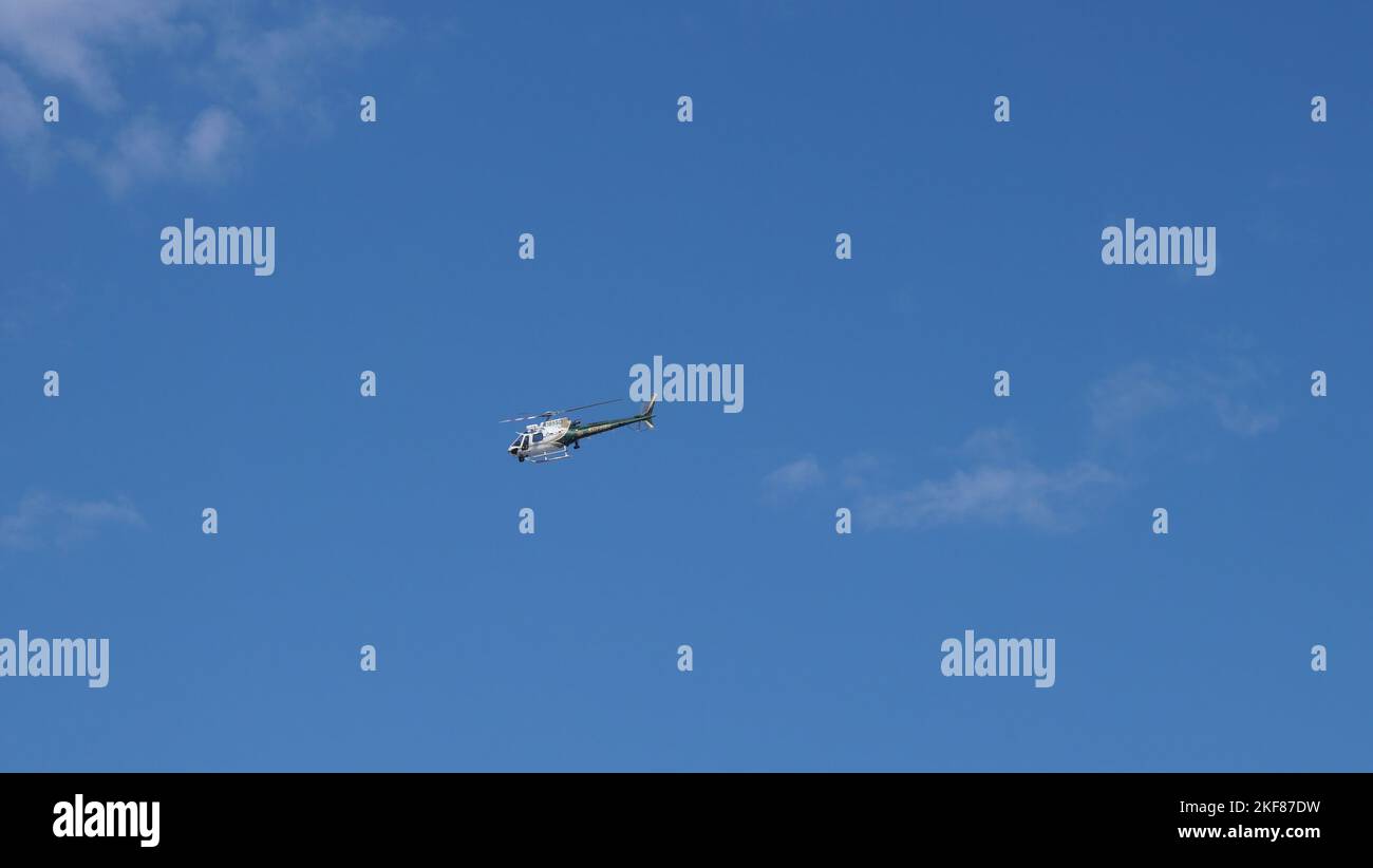 Orange County Sheriff helicopter in the sky in San Clemente, California
