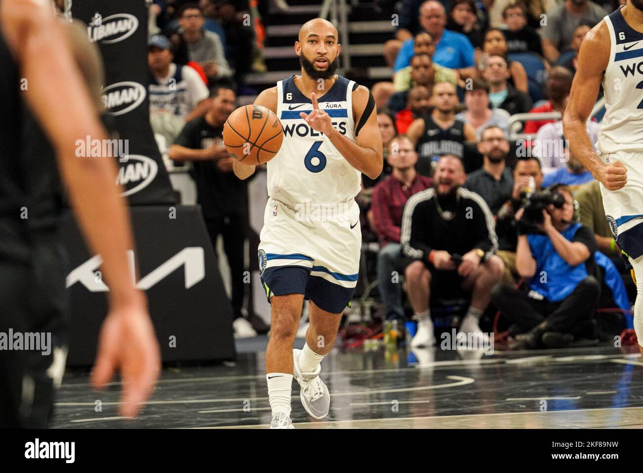 Minnesota Timberwolves guard Jordan McLaughlin (6) passes while defended by  San Antonio Spurs forward Doug McDermott (17) during the first half of an  NBA basketball game, Wednesday, Oct. 26, 2022, in Minneapolis. (