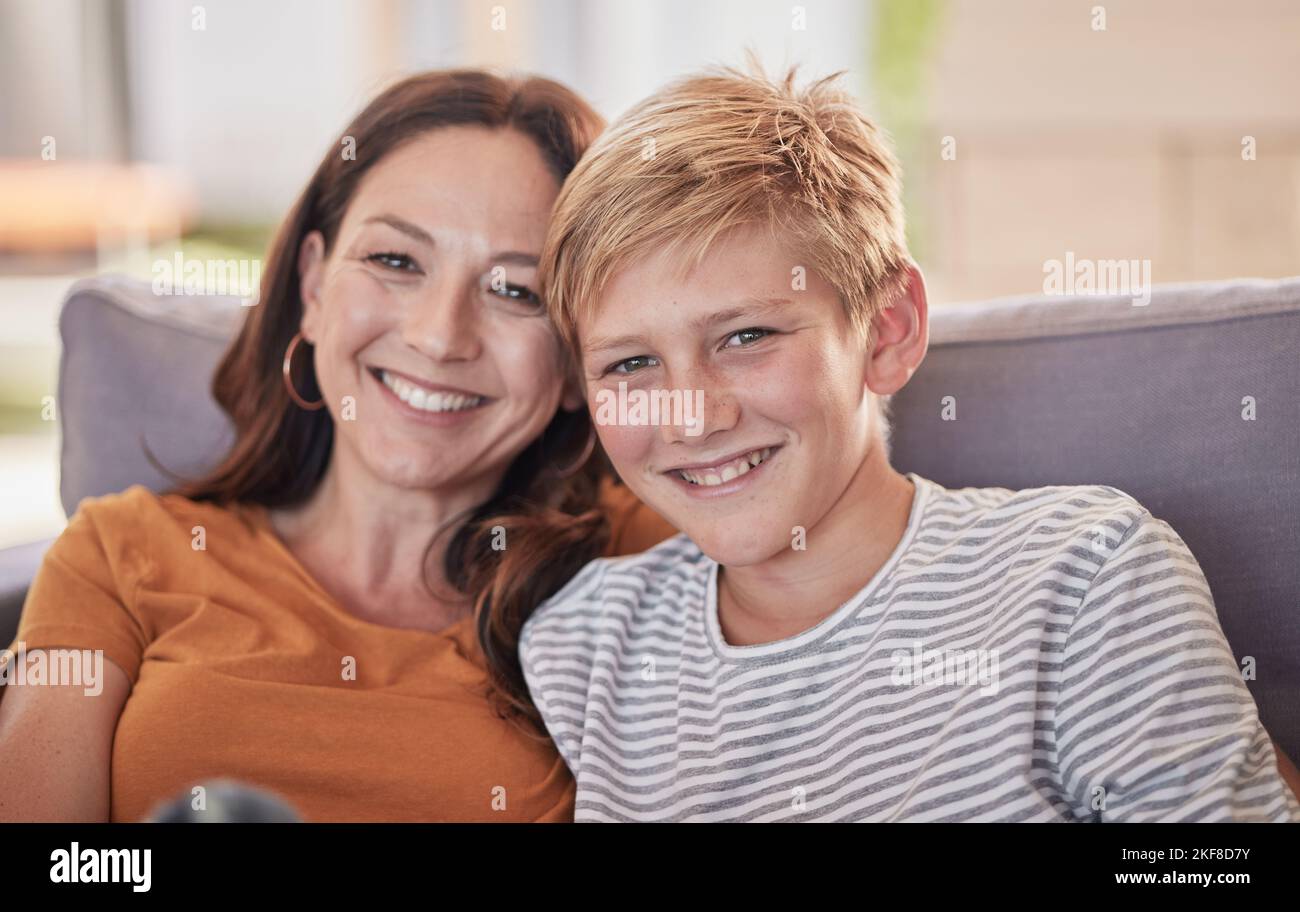 Love, family and portrait of mother and child on a sofa, happy and smile while bonding, embrace and laughing together. Mom, son and happy family Stock Photo