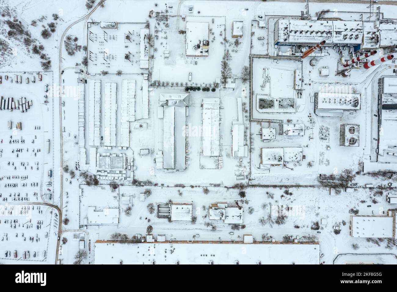 aerial top view of snowcovered industrial area of the city with