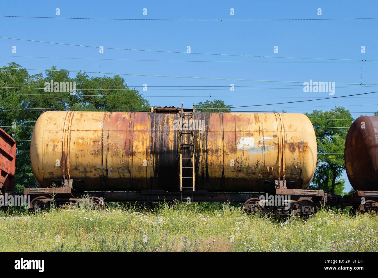 old tank for oil transportation stands on the railway