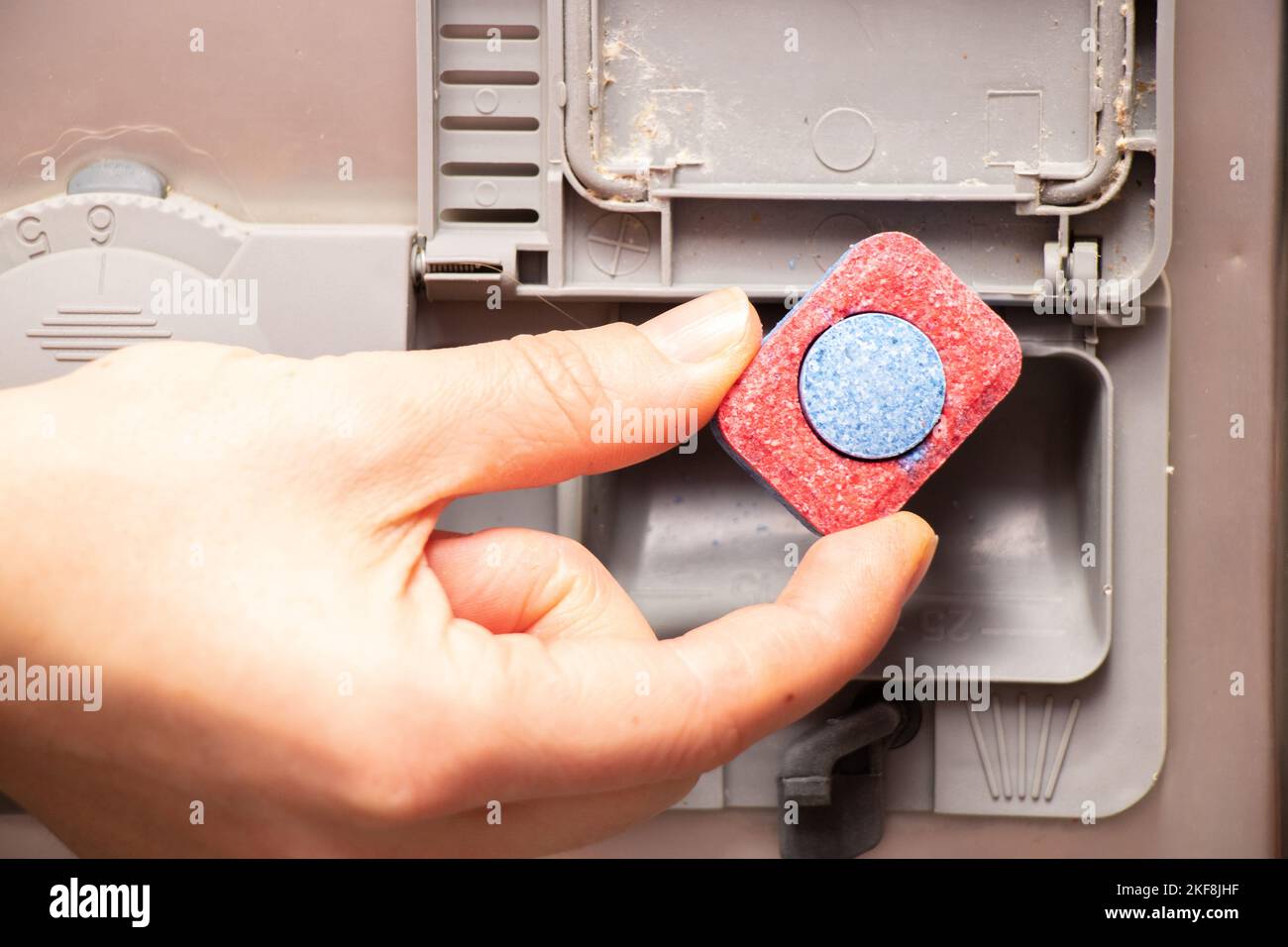 dishwashing tablet is in the dishwasher container, washing dishes Stock