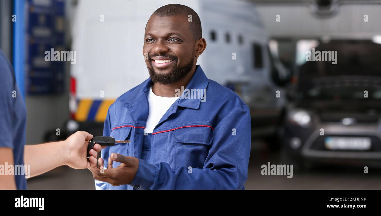 Professional car mechanic giving hi-res stock photography and images ...
